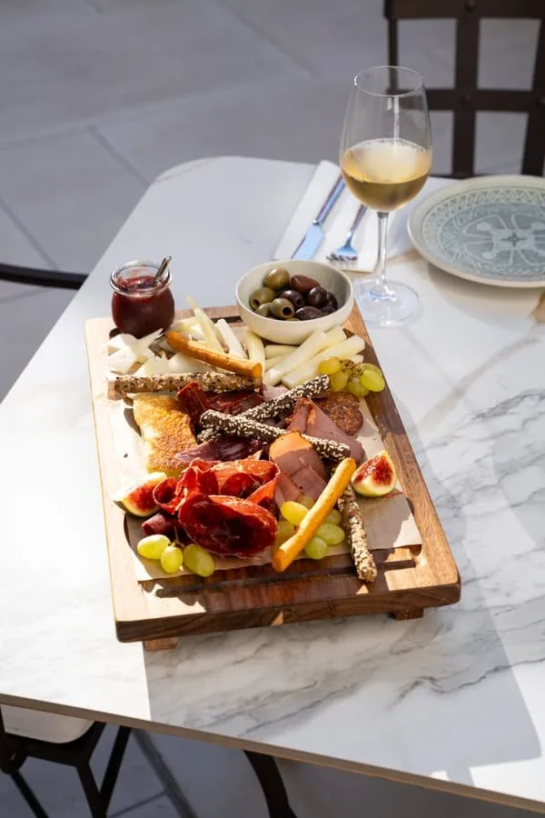 A charcuterie board and wine