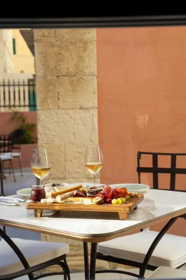 A board and wine in the courtyard
