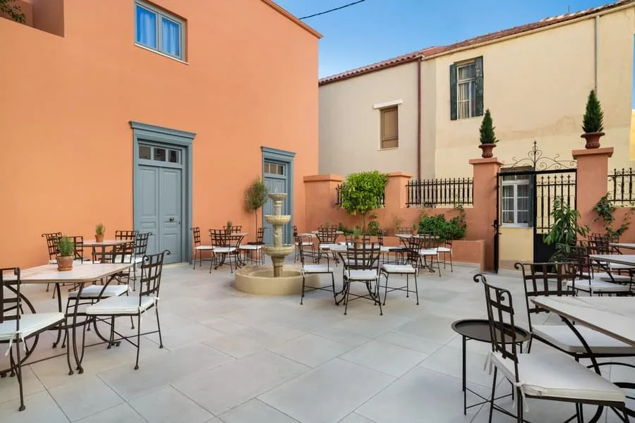The terracotta wall of the courtyard