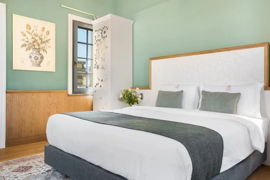 A bed with a botanical print