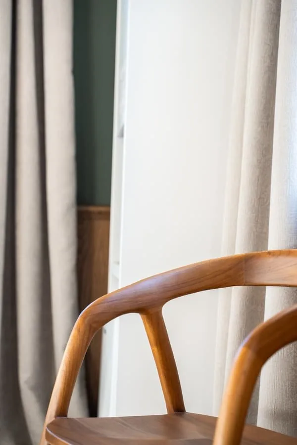 A chair and a curtain
